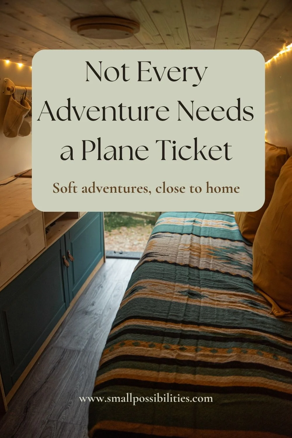 Cozy converted van interior with striped blanket and soft lighting, symbolizing mindful staycations and slow travel without flying.